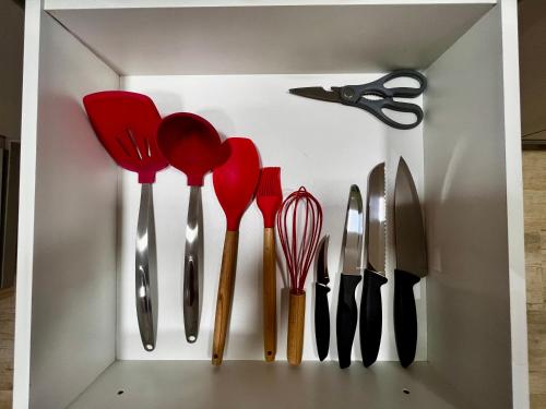 a white box filled with utensils and scissors at Hotel APART Zuccolotto 2 in Aracruz