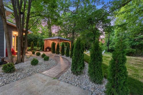a garden with trees and a gazebo at The Luxe/Hot Tub/12min to Horse Park/30 Min to Ark in Georgetown