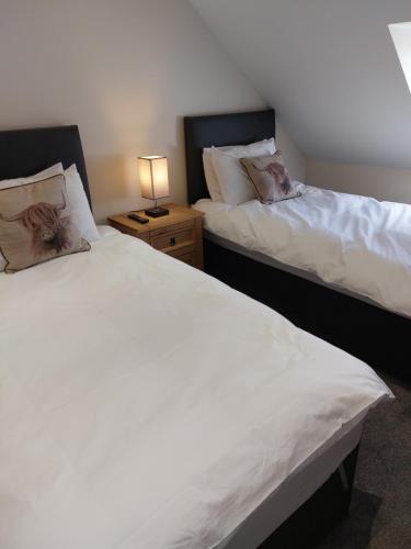 Ένα ή περισσότερα κρεβάτια σε δωμάτιο στο Hebridean Stay