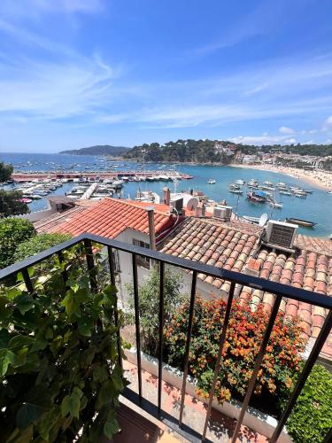 a view of a harbor with boats in the water at Apartment in front of the sea in Llafranc