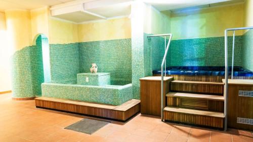 a bathroom with a shower and a bath tub at Hotel Residence Campi in Tremosine Sul Garda