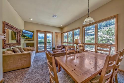 a dining room with a table and a couch at Kirkwood Mountain Resort Properties in Kirkwood