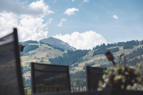 a view of a mountain from a window at Thalhof Apartments in Brixen im Thale