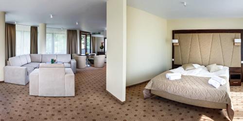 Ein Bett oder Betten in einem Zimmer der Unterkunft Hotel Royal Botanic