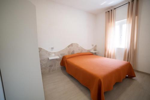 Postel nebo postele na pokoji v ubytování I Sapori Del Gargano