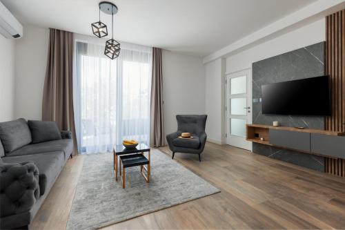 Μια τηλεόραση ή/και κέντρο ψυχαγωγίας στο Aria di Mare Apartments