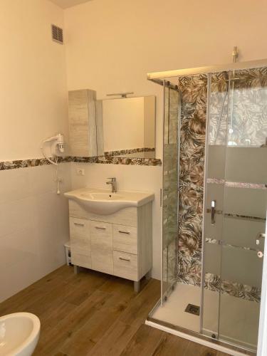 a bathroom with a sink and a shower at B&B Nonna Maria in Porto Garibaldi