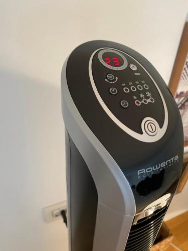 a hair dryer sitting on top of a toaster at Loft Crocetta in Turin