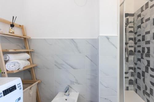 a bathroom with a sink and a shower at The aurora's home in SantʼAndrea