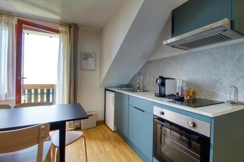 Η κουζίνα ή μικρή κουζίνα στο Vue Lac Léman & Piscine - Parking free - Confort Appart 6 pers