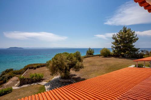 a view of the ocean from the roof of a house at Alterra Vita Captain's Cabin in Neos Marmaras
