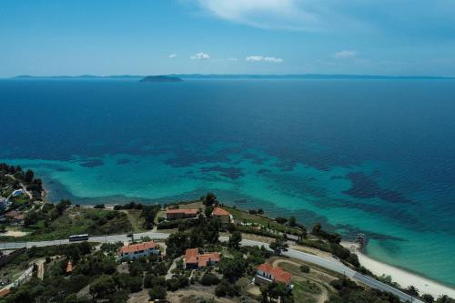 an aerial view of a beach and the ocean at Alterra Vita Captain's Cabin in Neos Marmaras