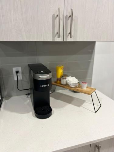 a trash can sitting on a counter in a kitchen at Beautiful 2 bedroom home away from home in Calgary