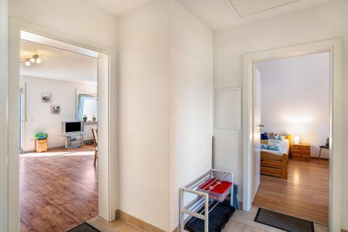 a room with a door leading to a bedroom at Schwalbenhof Dreßler und Duss für 6 in Bad Herrenalb
