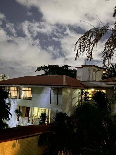 a house at night with the lights on at La Cour Hotels and Apartments Cooper in Lagos