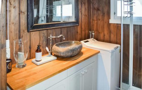 a bathroom counter with a sink and a mirror at Cozy Home In Dagali With House A Mountain View in Dagali