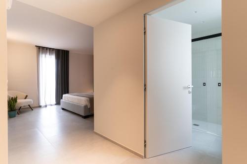 Postel nebo postele na pokoji v ubytování MORUS Urban Suites