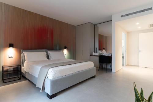 Postel nebo postele na pokoji v ubytování MORUS Urban Suites