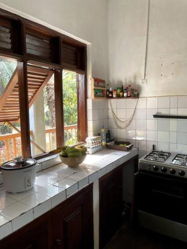 Kjøkken eller kjøkkenkrok på Villa calme - Jardin Tropical - Kpalimé