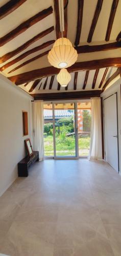a large living room with a vaulted ceiling at Jahayeon Hanokstay in Jeonju