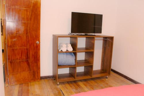 Televízia a/alebo spoločenská miestnosť v ubytovaní Nishihouse