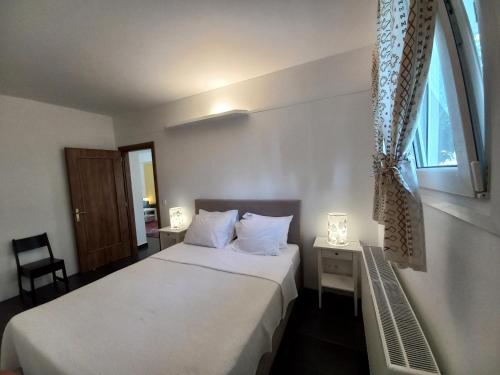 Posteľ alebo postele v izbe v ubytovaní Elysion point Apartment