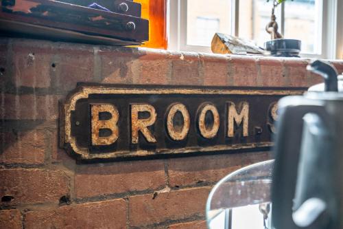 a sign on a brick wall with the word bacon at The Enchantment Chamber in York