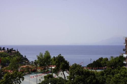 a view of a beach with the ocean in the background at Royal Homes 503 in Antalya