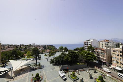 a view of a city with the ocean in the background at Royal Homes 503 in Antalya