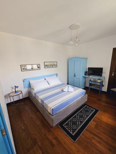 Postel nebo postele na pokoji v ubytování Casa Vacanze L'Ulivo di Ugo