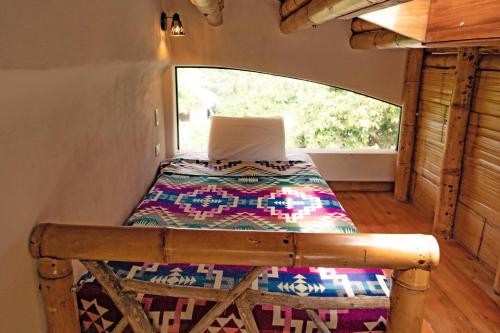 Lova arba lovos apgyvendinimo įstaigoje Tierra Munay