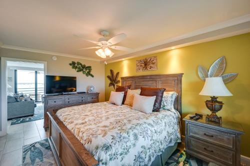 a bedroom with a bed and a ceiling fan at Coastal Marco Island Condo with Club Amenities! in Marco Island