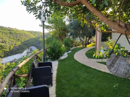 a walkway with chairs and a view of a river at B&B Volver in Peschici