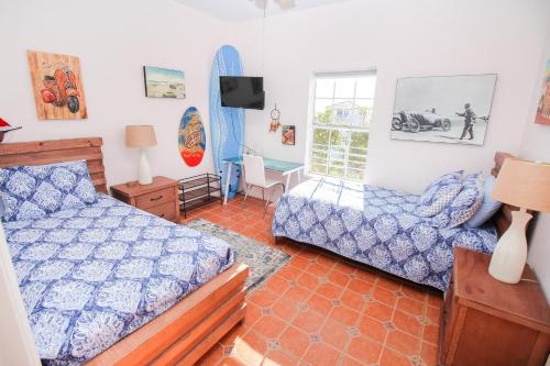 a bedroom with a bed and a chair at Ocean Club at Turtle Mound 207 in New Smyrna Beach