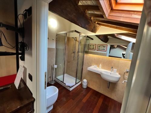 a bathroom with a shower and a toilet and a sink at a casa di paola in Ravenna