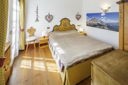 Cama o camas de una habitación en Villa Ronco - Stayincortina
