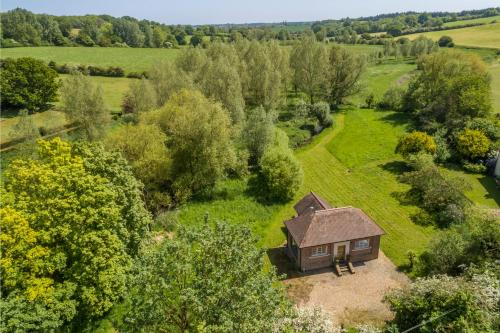 an aerial view of a small house in a field at The Pump House in Colchester