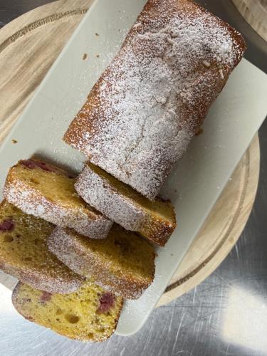 two slices of bread on a plate with powdered sugar at Cento Giorni B&B Costa Paestum in Capaccio-Paestum