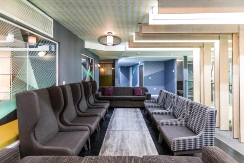 a waiting room with chairs and couches in a building at For Students Only - Queen's Court Reading in Reading