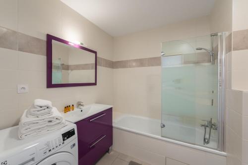 a white bathroom with a sink and a shower at Les Loges Blanches - Apt B103 - BO Immobilier in Châtel