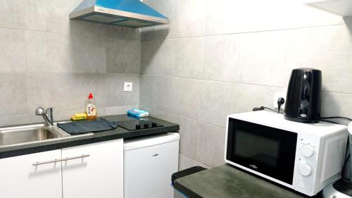 Superbe appartement Disneyland Paris Parkingにあるキッチンまたは簡易キッチン