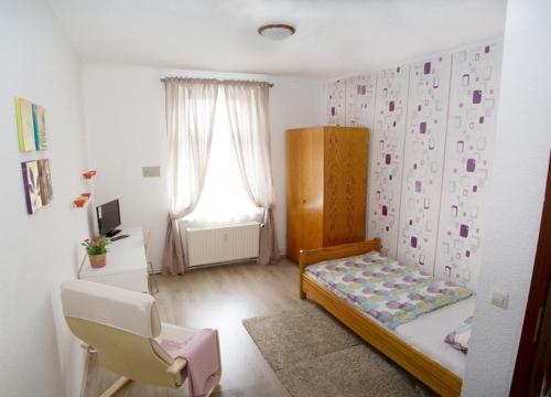Ένα ή περισσότερα κρεβάτια σε δωμάτιο στο Rael-Boardinghouse