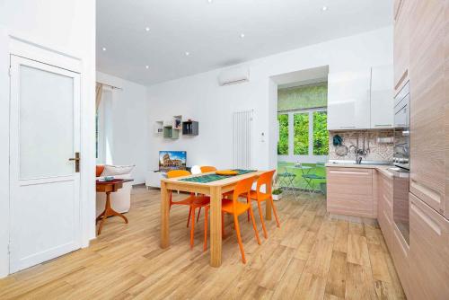 a kitchen and dining room with a table and chairs at Fieschi 316 Marola, Terre Marine in La Spezia