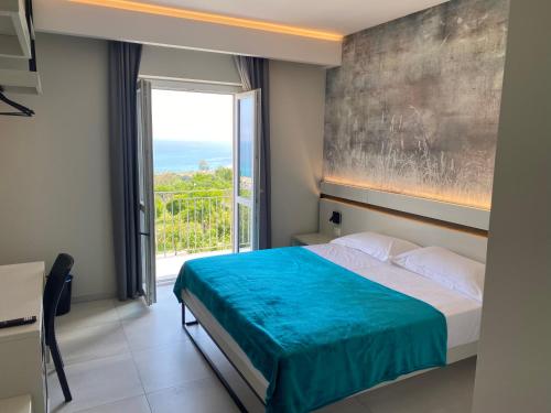 Ένα ή περισσότερα κρεβάτια σε δωμάτιο στο Gabriel Holidays Tropea