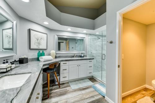 a bathroom with two sinks and a shower at Newly Renovated Palm Desert Condo Community Pool! in Palm Desert