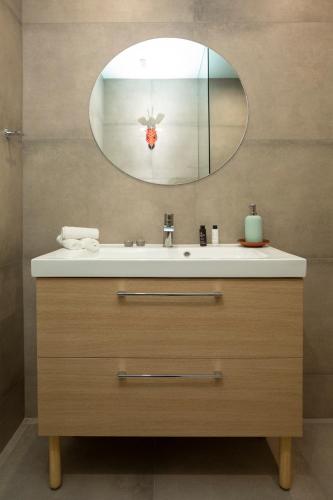 a bathroom with a sink and a mirror at The Frogs_Guest House in Athens