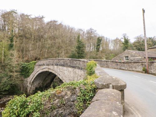 a stone bridge on the side of a road at Old Wool Shop in Leyburn