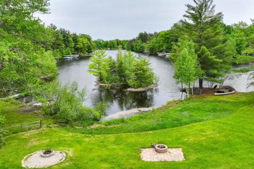 an aerial view of a river with boats in it at Lakeside Cabin with Fire Pit Near Pine Point Park! in Holcombe