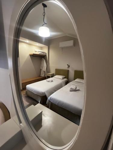 Postel nebo postele na pokoji v ubytování Eva Beach Hotel Lefkada