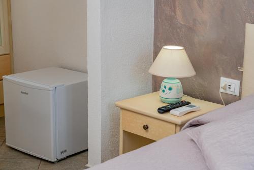 Postel nebo postele na pokoji v ubytování Rooms Tavolara